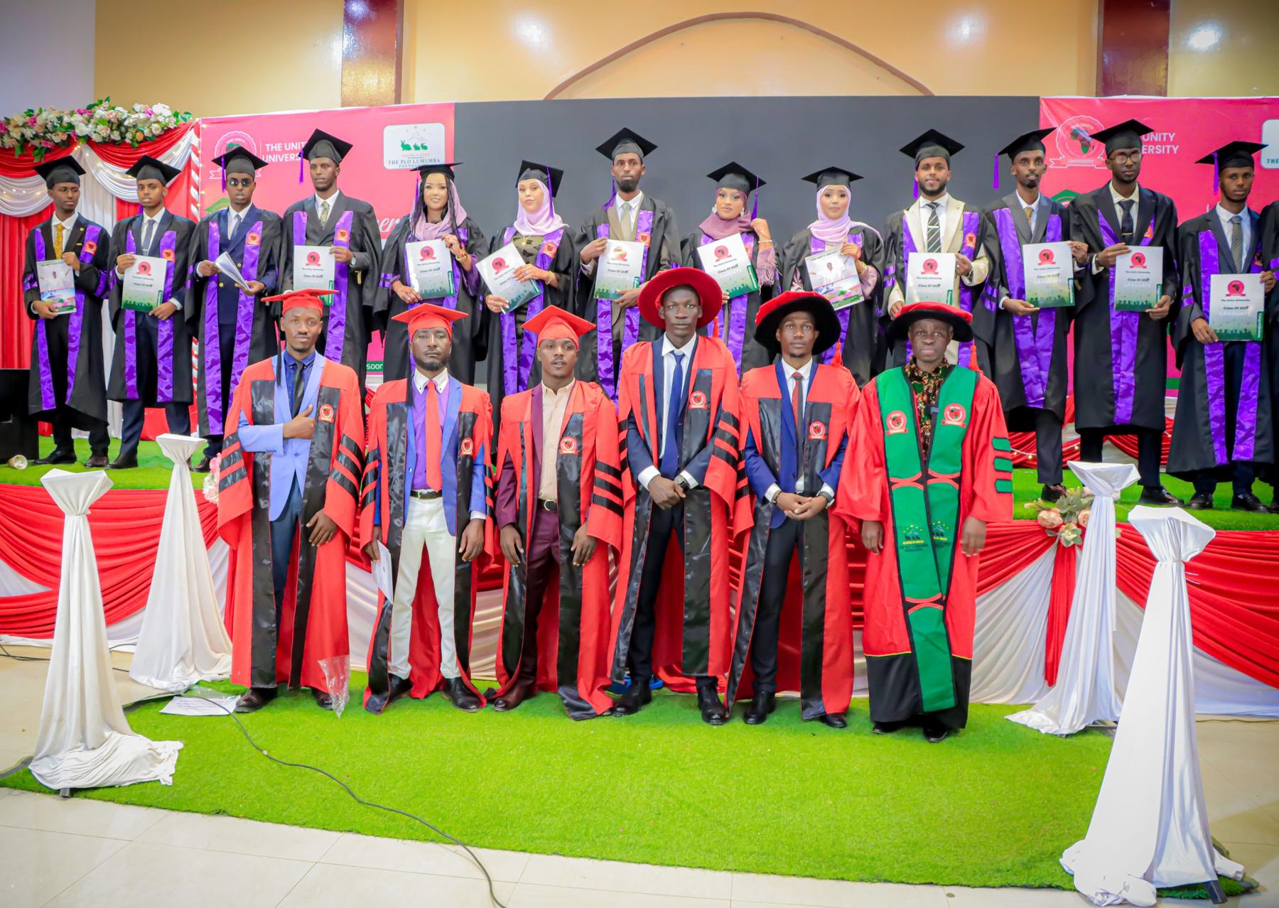 Graduates with their certificates