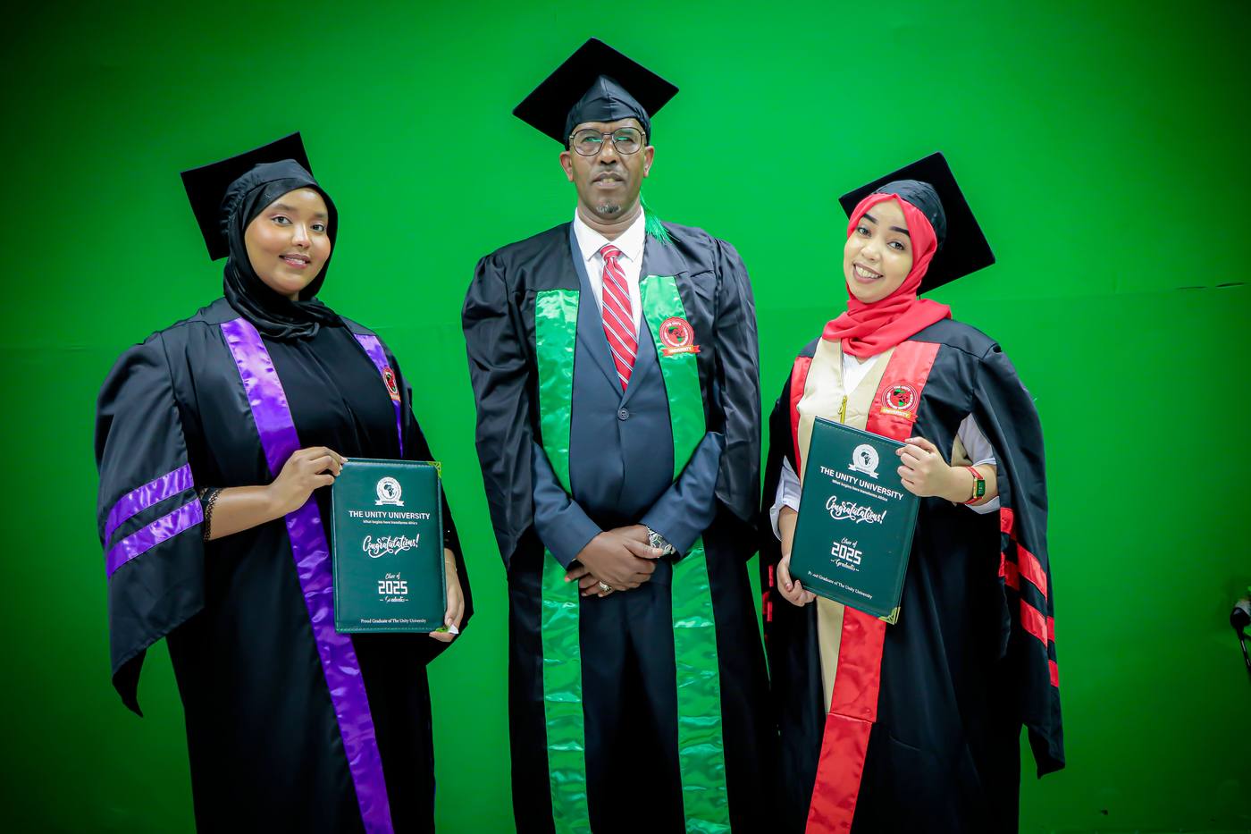 Graduates holding their Unity University certificates
