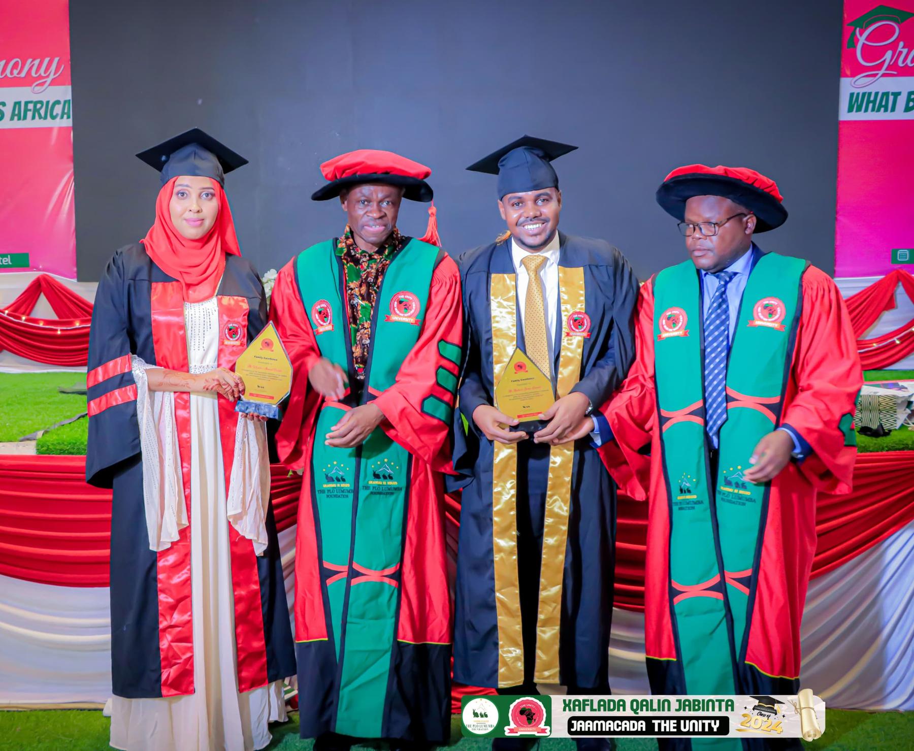 Graduates with colored sashes
